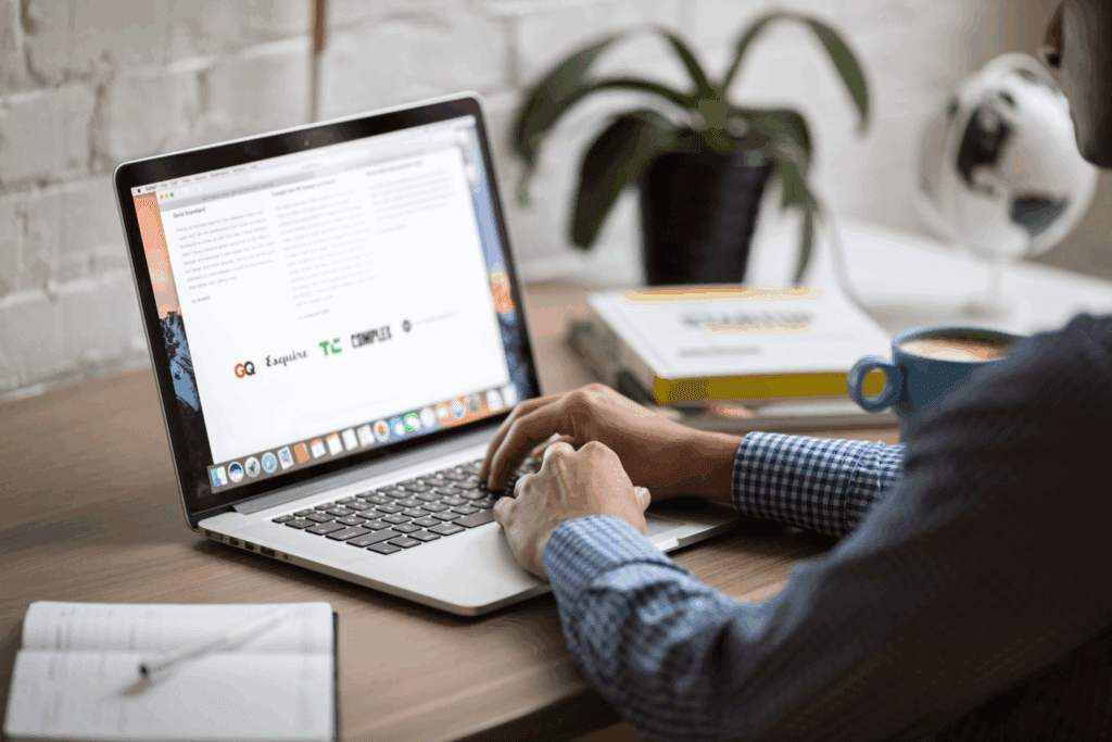 Marketing professional reviewing email newsletter performance metrics like click-through rate and conversions in the HubSpot email analytics dashboard