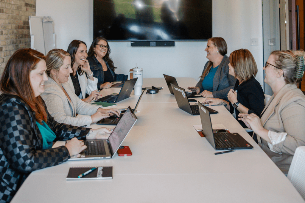 Sales team collaborating on sales enablement strategy and CRM optimization in 2025.