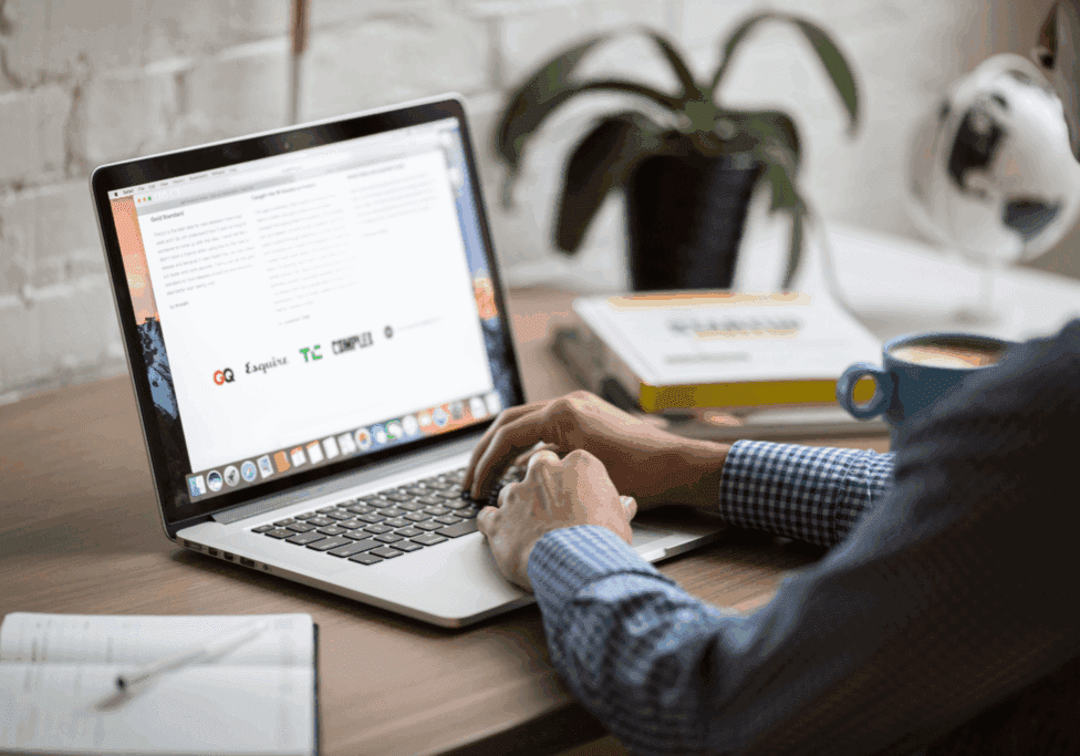 Email-Newsletter Marketing professional reviewing email newsletter performance metrics like click-through rate and conversions in the HubSpot email analytics dashboard