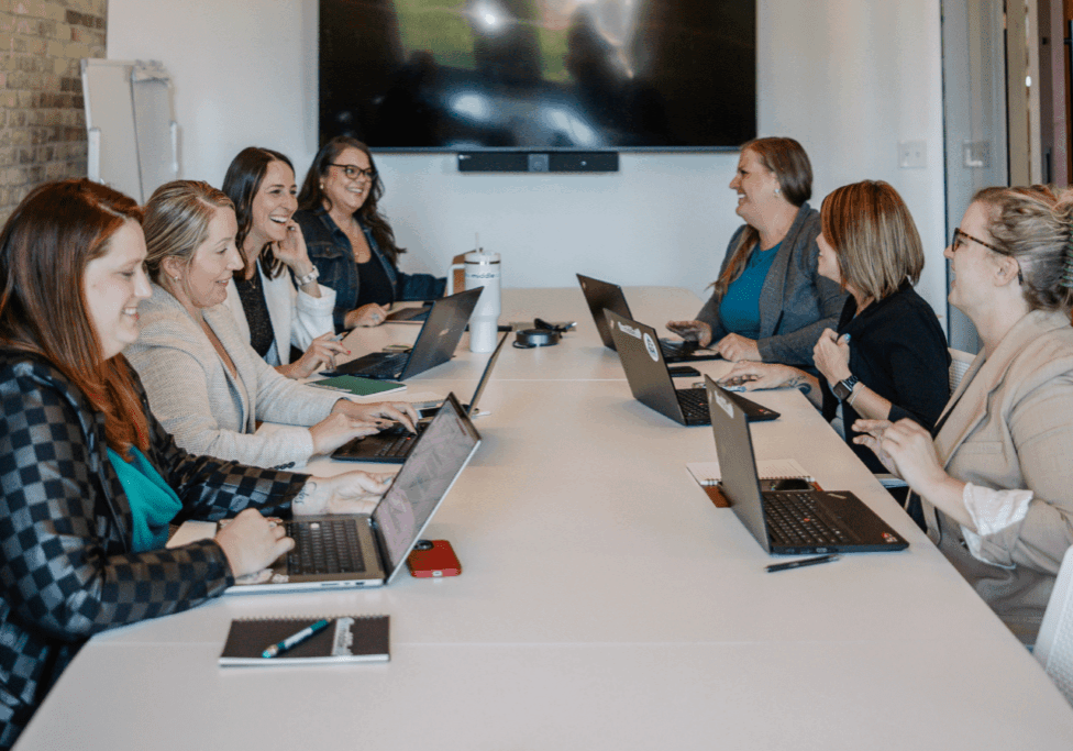 Sales team collaborating on sales enablement strategy and CRM optimization in 2025.